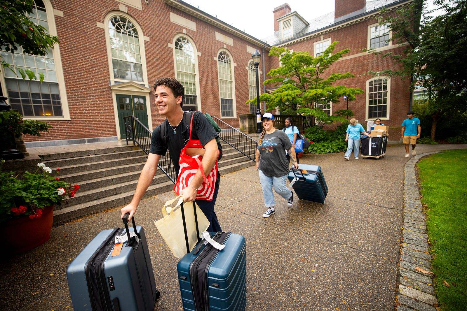 Students with suitcases on Brown campus during move-in day